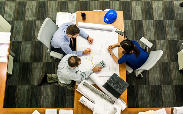 employees sitting and talking about fleet management